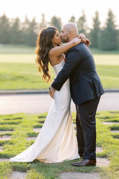 Bride and groom kissing