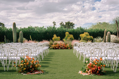 Ceremony ground flower arch in fall colors at the Andaz Resort Scottsdale AZ by Snapdragon Bloom Bar