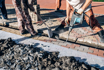 workers-laid-paving-slabs-two-workers-lay-paving-2025-01-07-09-46-58-utc (1)
