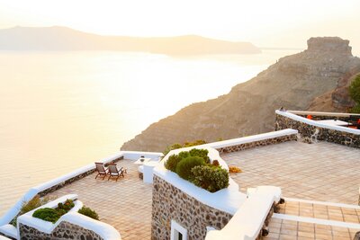 Luxury honeymoon planning services by Kelsey Parry Travel featuring sunset view in Greece