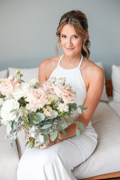 Bride sitting with flowers in hand austin wedding photographer texas wedding photographer