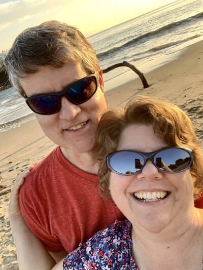 Certified cognitive stimulation instructor with her husband on the beach