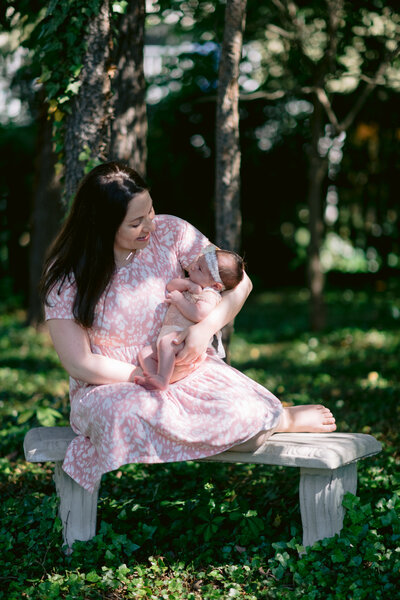 Mom kissing newborn