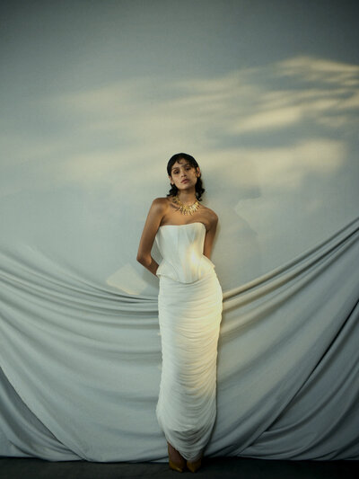 black and white image bride wearing  long sleeve lace wedding dress