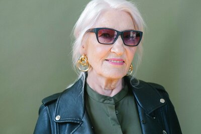 Perfectionist Solutions client gertrude holding purse 