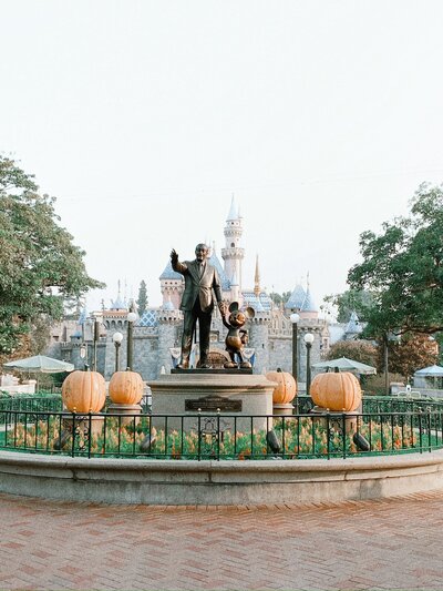 Castle at Disneyland with Walt and Mickey Mouse statue