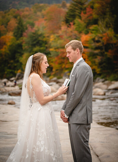 new hampshire elopement couple reading vows