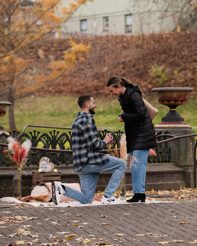 Down on one knee during their Congress Park Proposal in Saratoga Springs, NY.