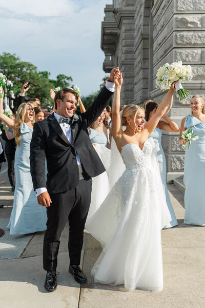 bridesmaids hugging bride after ceremony