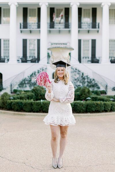 Graduate with pom pom and cap