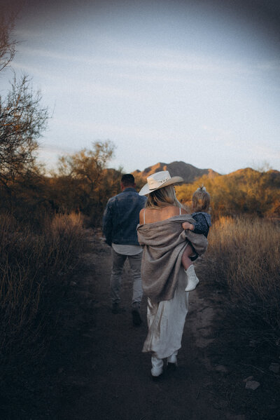 Family walking through Scottsdale desert