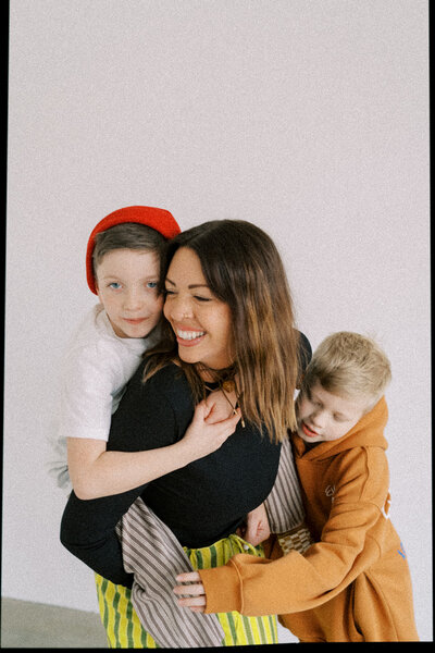 Tonya holds her son while they close their eyes.