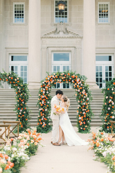 bride and groom on staircase in garden walking