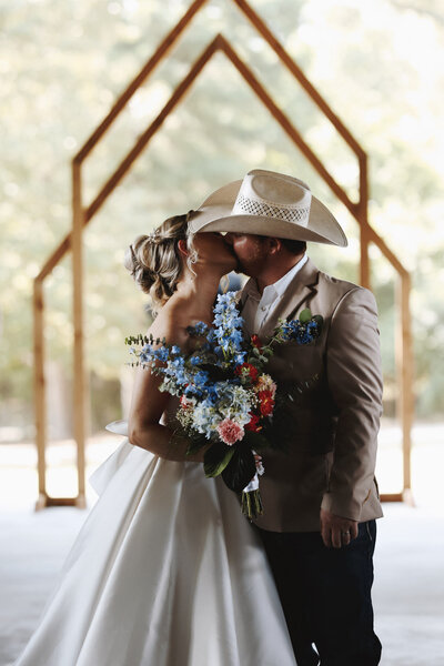 bride groom first kiss outdoor ceremony wedding mount pleasant