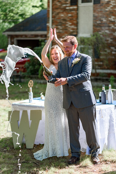 Champagne pop at Massachusetts backyard wedding