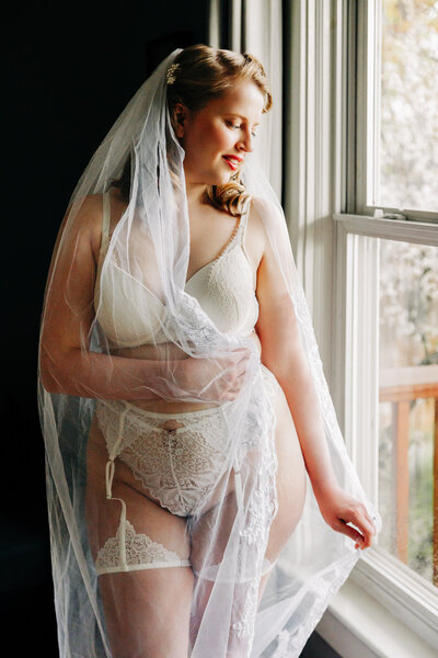 Bridal boudoir image Missoula woman in white lingerie and wedding veil
