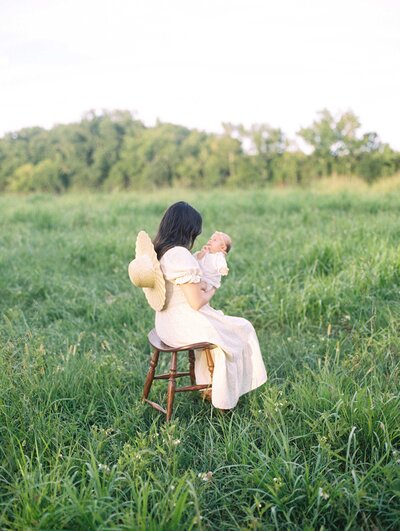 Richmond Family Photographer | FIlm photo of a mother holding her newborn baby in a field by Jacqueline Aimee Portraits