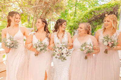 A magical wedding day at the Liriodendron Mansion on the mansion's back porch under the wisteria, with Liriodendron Mansion Wedding Photographer