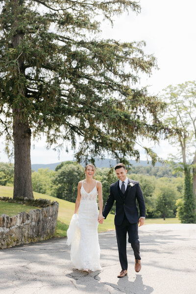 An ethereal couple and venue overlooking the rolling hills of New York.