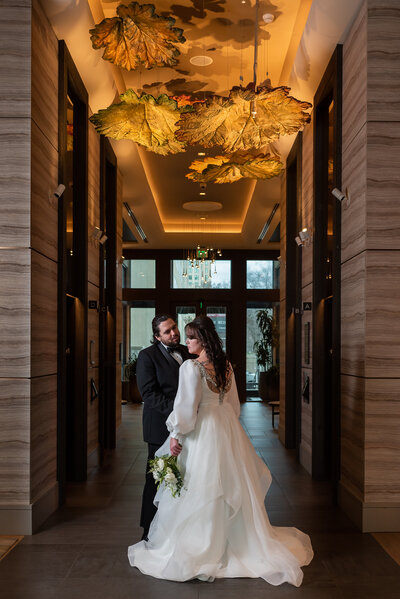 Bride and groom looking at each other laughing  outdoors backyard wedding by Charlotte wedding photographers DeLong Photography