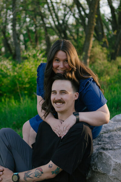 Tattooed couple sharing a candid moment during their alternative micro-wedding in Springfield, MO, photographed by Chelsea Stanford