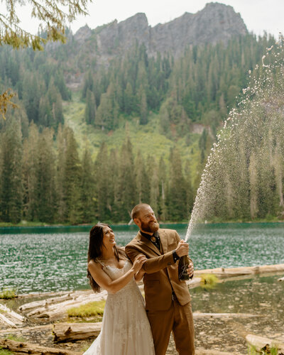 bride and groom in mountains at sunset