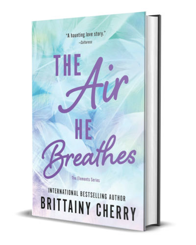 man with beard wearing a white shirt looks down on the cover of the air he breathes by romance author brittainy cherry