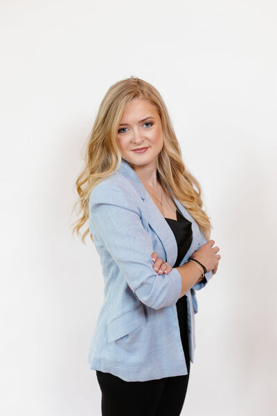 A woman posing for the camera with her arms crossed