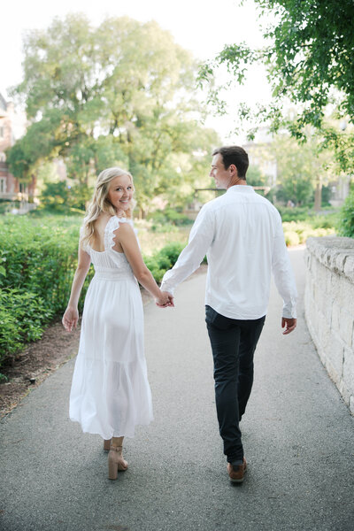 couple looks back while walking