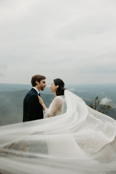 couple standing at Ravens Roost Overlook during their elopement