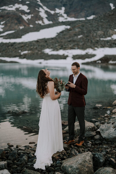 A couple embracing in front of a beautiful lake in Italy