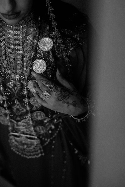 a monochrome close up portrait of an Emirati bride wearing traditional wedding attire