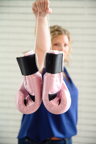 Boxing gloves that symbolize empowerment for Christian business owners who listen to podcasts.