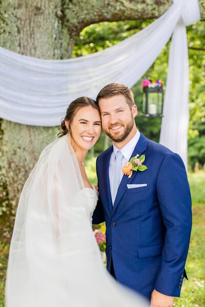bride and groom smiling on their wedding day