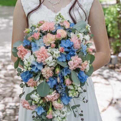 L shaped funeral arrangement that is on the inside of the casket lid