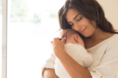 Peaceful moments at our postnatal retreat in Texas as a new mom sleeps with her baby girl. Dressed in matching pink attire, they enjoy the comfort and serenity of our nurturing environment.