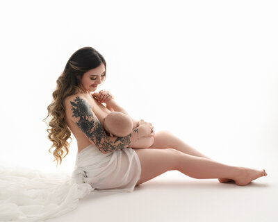 Baby photographer, Syracuse, Mom and baby, skin to skin, white backdrop