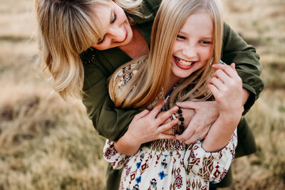 mom-snuggles-daughter