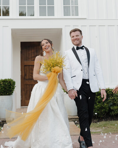 bride and groom smile