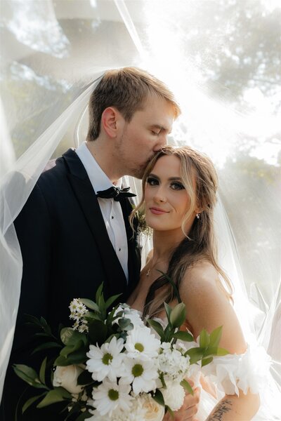 Bridal portraits, veil, florals, wedding dress