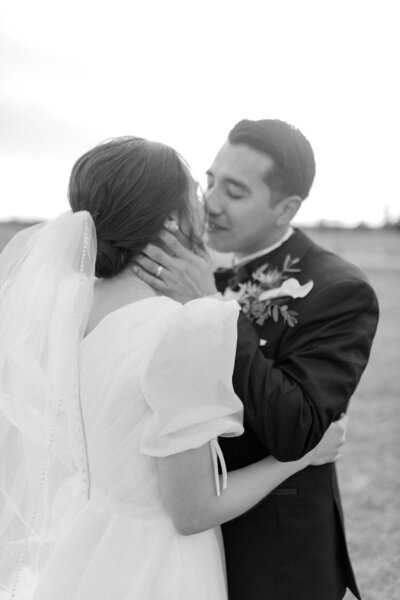 bride & groom joyfully smiling at the camera