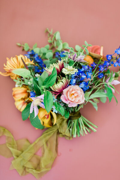 A vibrant, colorful, tropical inspired bridal bouquet for a wedding on the California Coast at Dos Pueblos Orchid Farm.