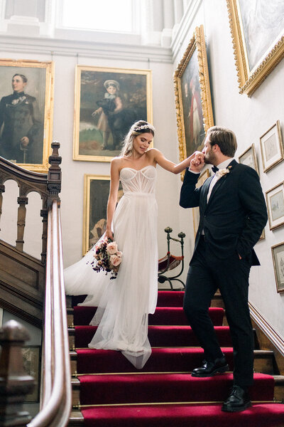 In this stunning portrait by Tiffany Longeway, a radiant bride in Napa Valley exudes grace and elegance. The photograph captures the serene beauty of the vineyard setting, complementing the bride's joy on her special day.