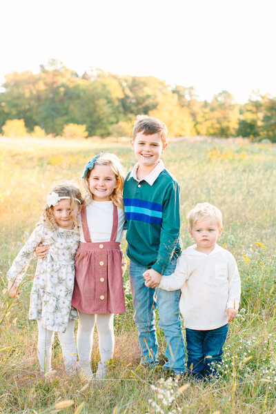 children in field during family session, kent island maryland