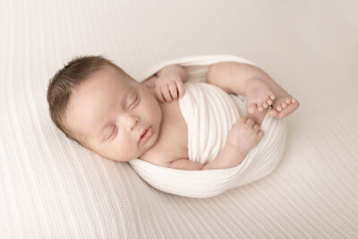 baby boy in white wrap during his Lehigh valley Newborn session