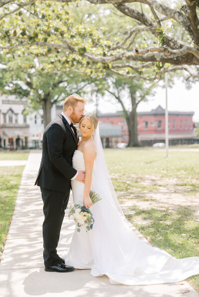 bride and groom embracing