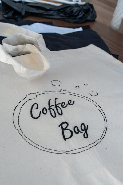 Tote bag embroidered with a coffee logo