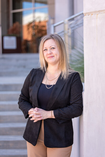 Attorney Erin K. Urquhart of McDow & Urquhart LLC standing outside the Rock Hill, SC courthouse, smiling in a professional portrait.