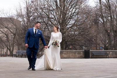NFL Free Agent and Bride walking near Cathedral of Learning in Pittsburgh, PA  on their wedding day