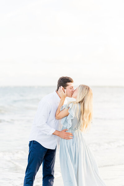 engaged couple dipping in ocean on sullivan's island